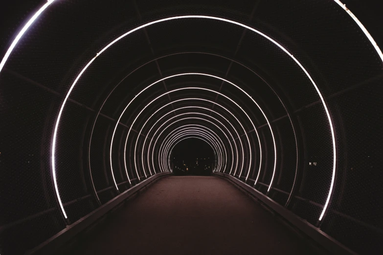a tunnel with lights going into it