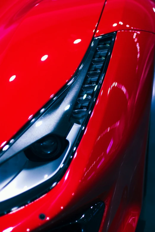 the front part of a red sport car