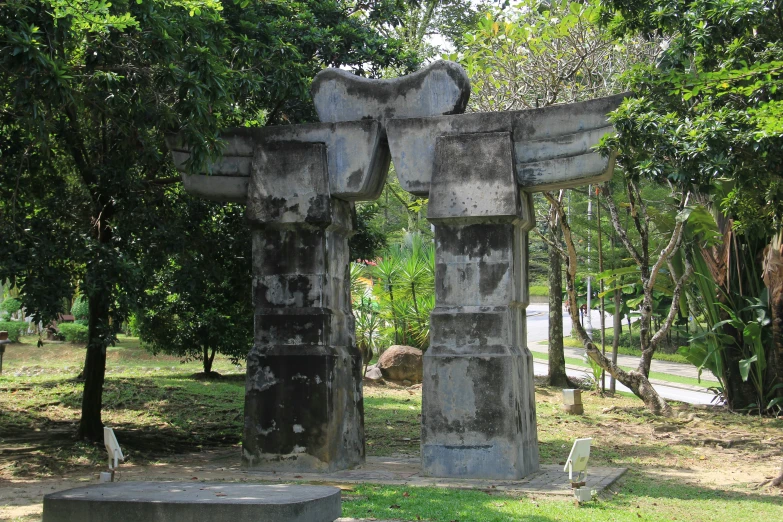 an ancient building is being displayed with a large statue in the middle