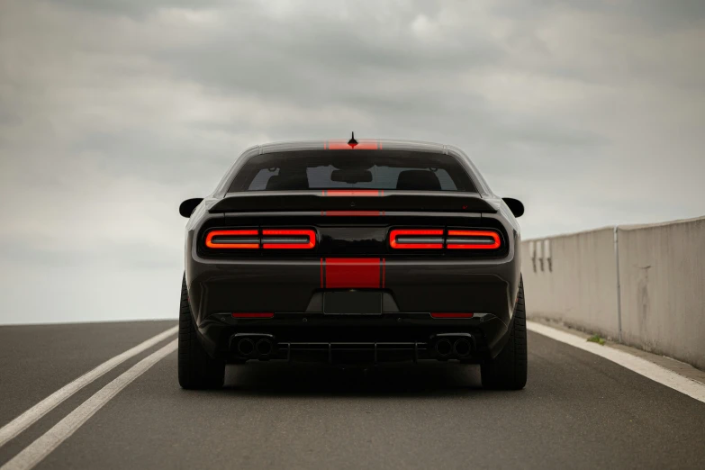 a black sports car parked on the side of the road