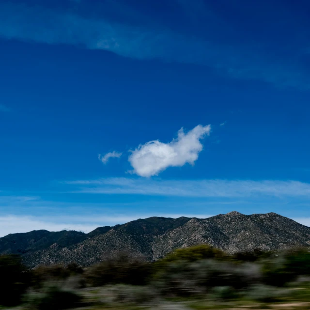 an airplane is in the sky, making it appear like an object