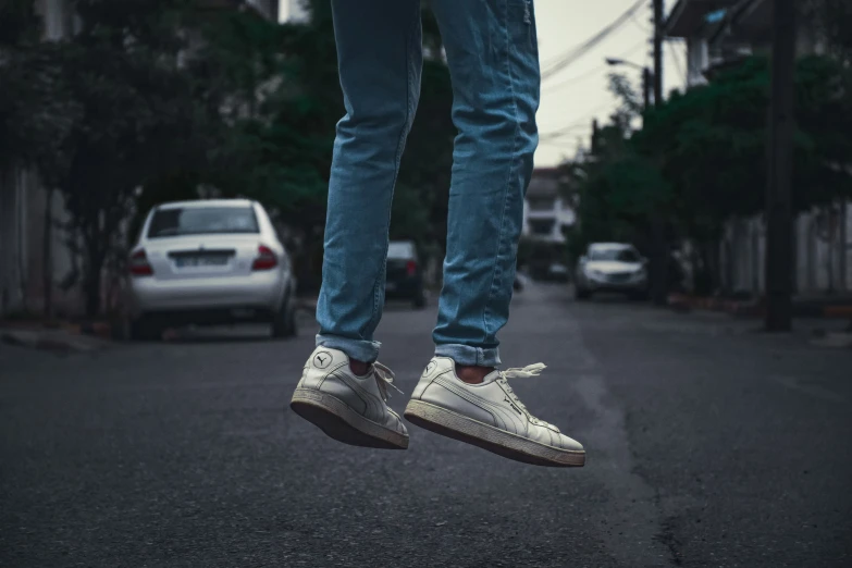 a person jumping up into the air on a skateboard