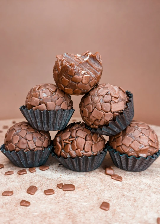 five chocolate peanut er cupcakes on top of each other