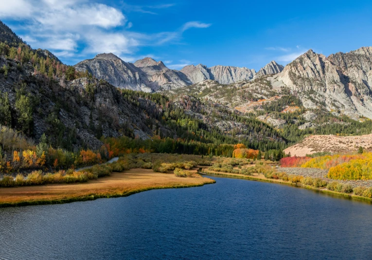 some mountains and water in the fall