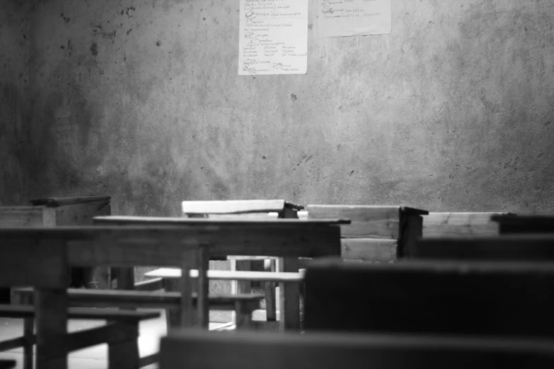 black and white po of tables with wooden benches