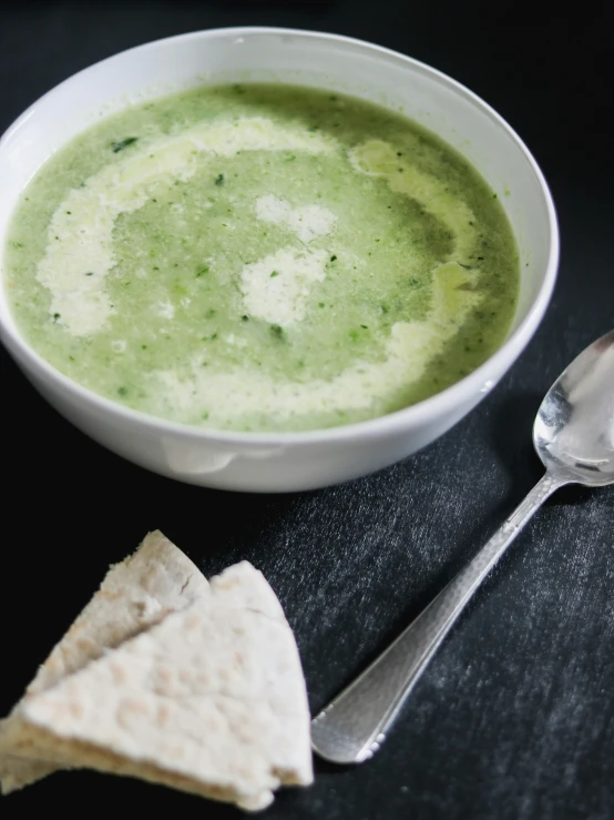 there is a bowl of soup with ers and spoon