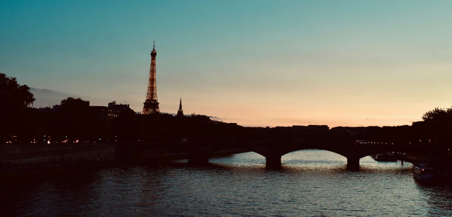 a very tall building next to a bridge