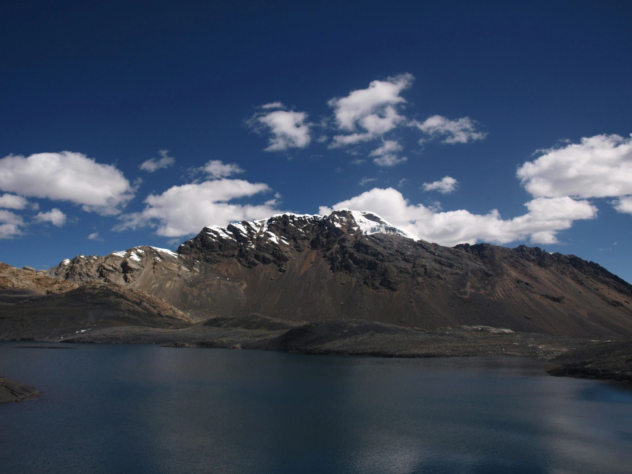 large mountain with snow on top in the sky