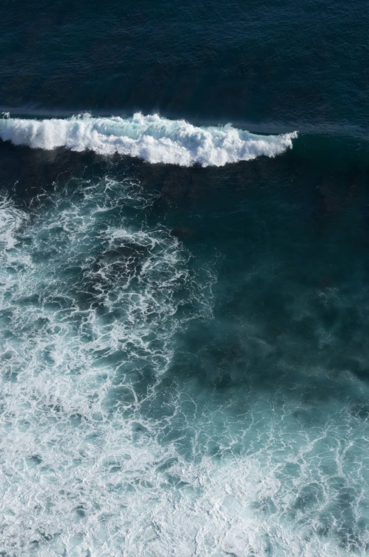 the view of a surfboard on top of some waves