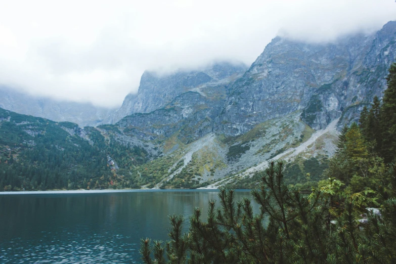 a mountain is shown next to the water