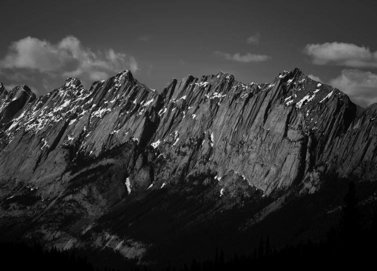 a mountain range with snow and rocks on the top