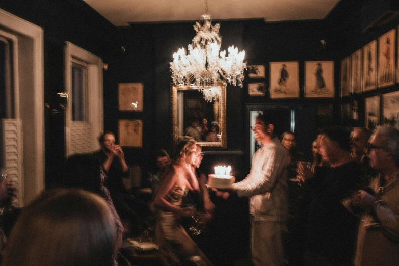 a large group of people in a dark room