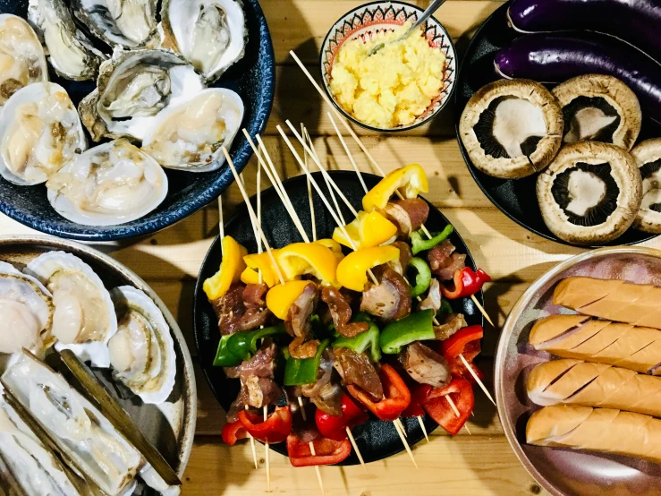 various foods are displayed on large plates, ready to be eaten