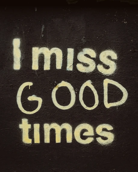 there is a black cloth with graffiti that says, i miss good times