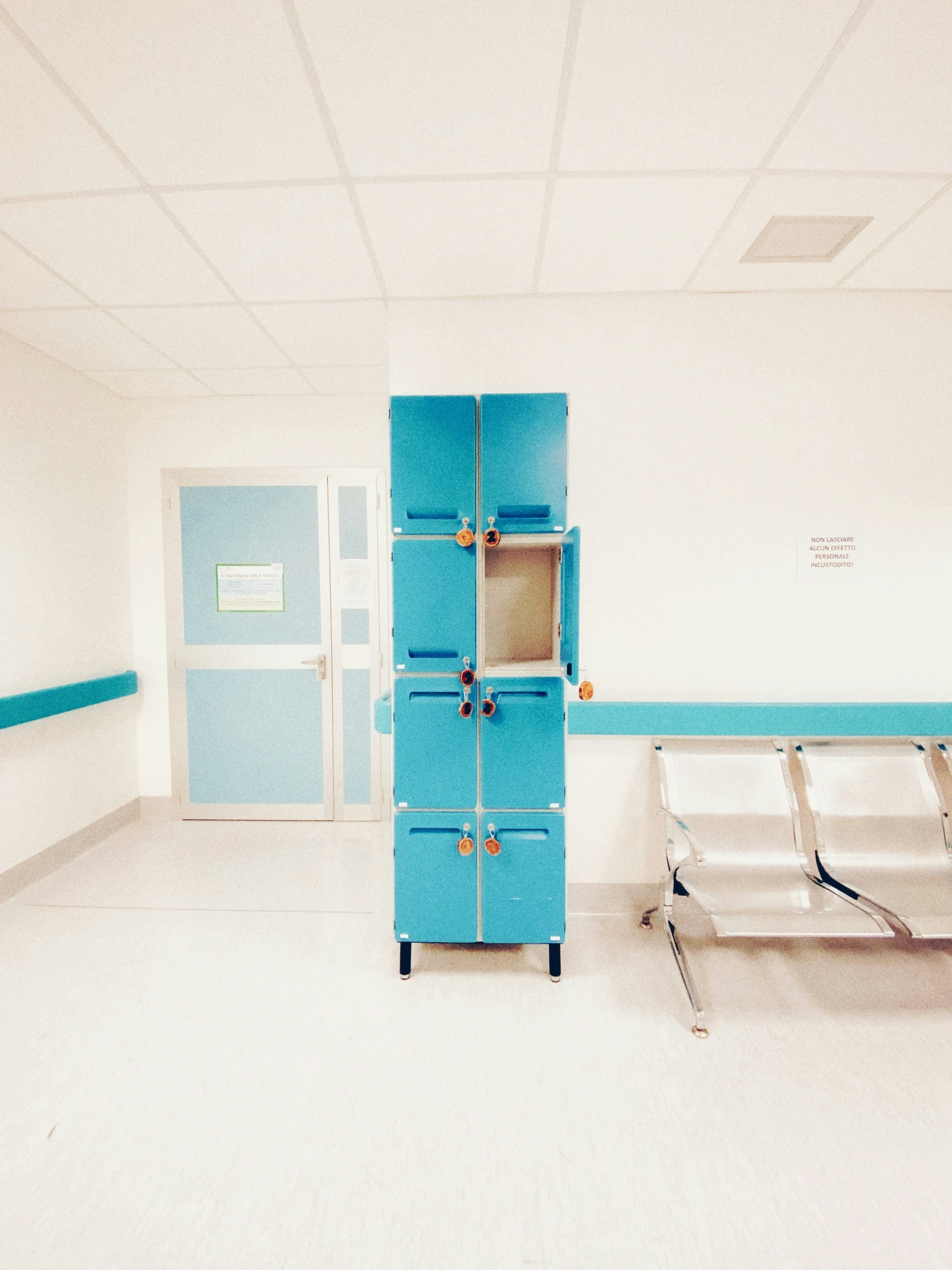 a room with a blue locker and shelf