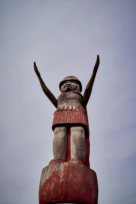 an elaborate statue stands in the foreground against a blue sky