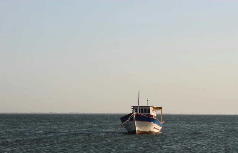 a boat that is in the water on a clear day