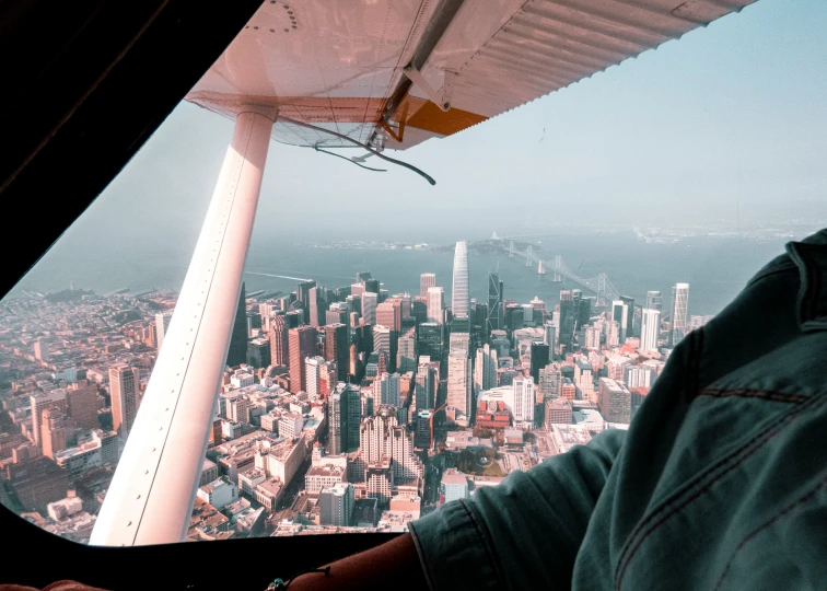 a man is flying through the air on an airplane