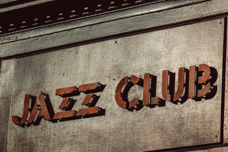 this sign reads baeb's club on a stone wall