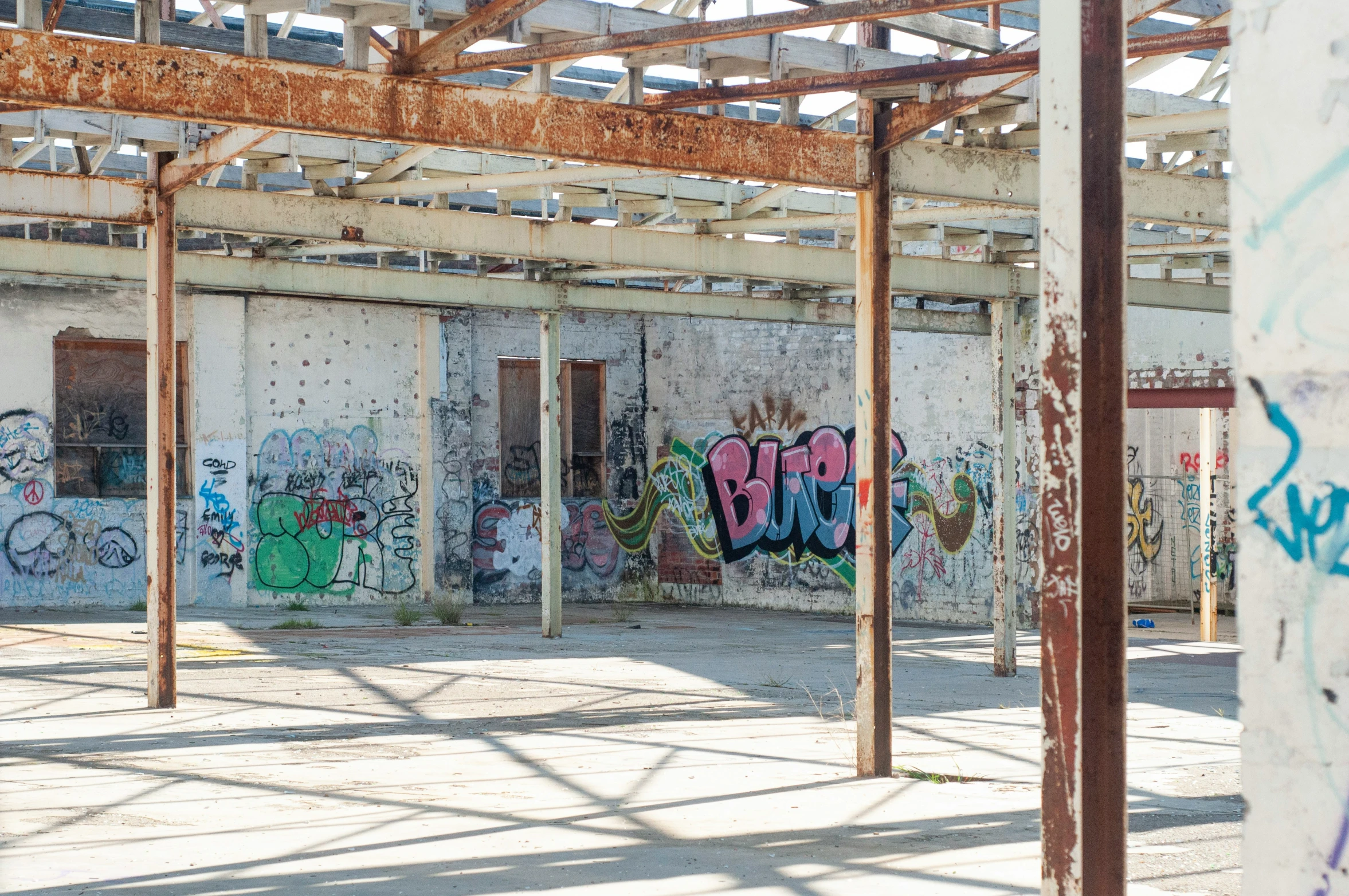 some graffiti on the walls in a rundown building