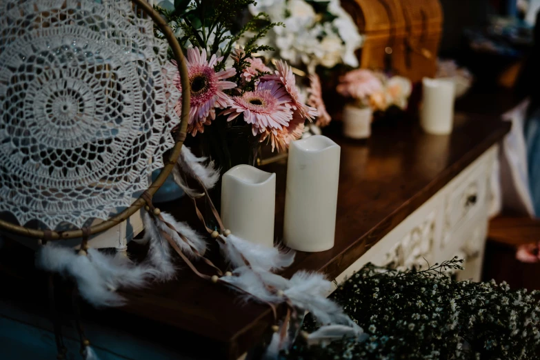 small candles and flowers sit on a table