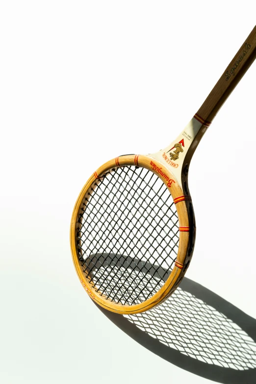 a tennis racket is standing on the ground