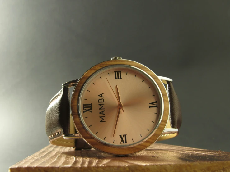 a clock sitting on top of a wooden stand