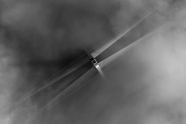 black and white pograph of a plane flying over