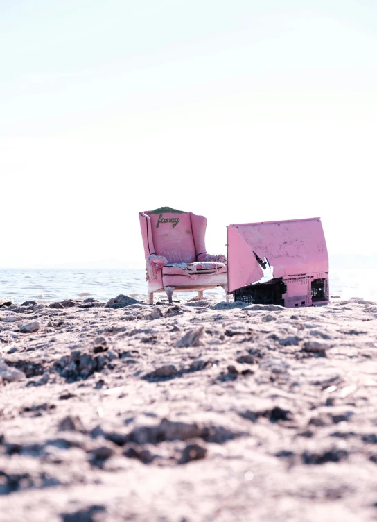 two chairs that are sitting on the beach