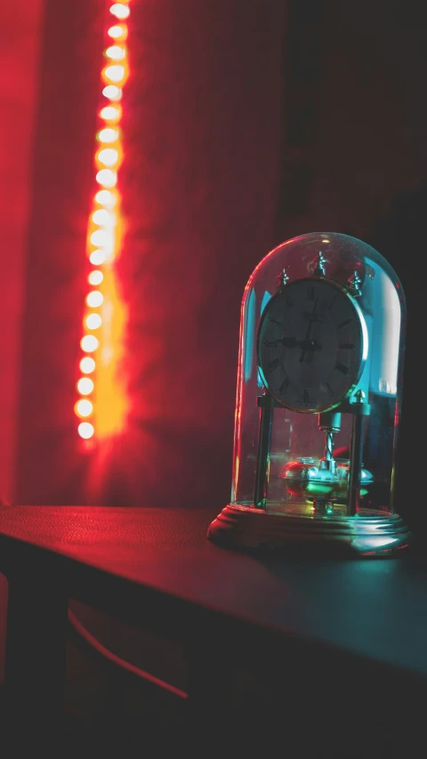 a clock that is glowing in the background