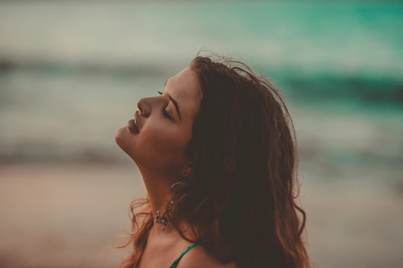 a woman with her hair blowing in the wind