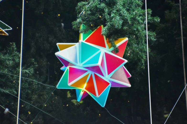 some colorful origami hanging on a line