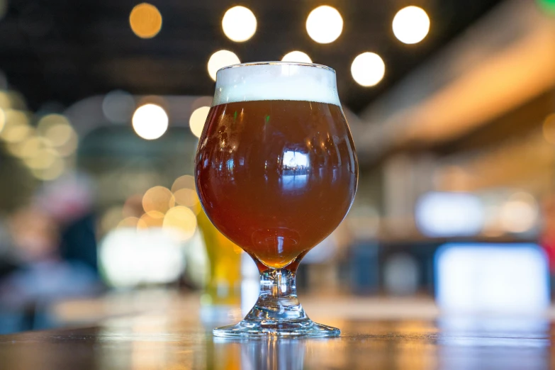 a close up of a glass with beer in it