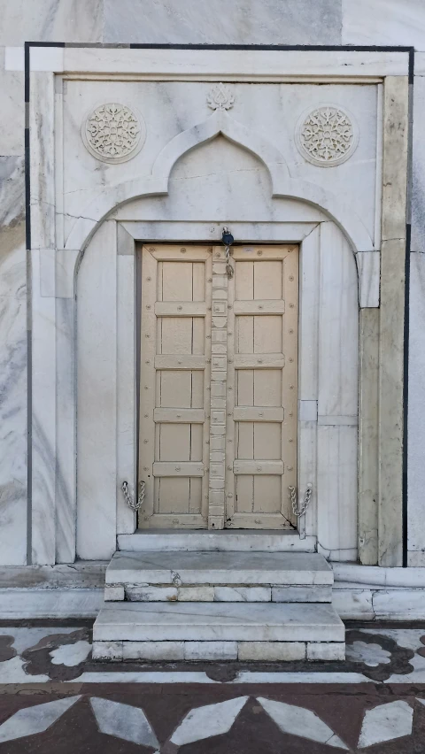 a doorway with two double doors sitting above it