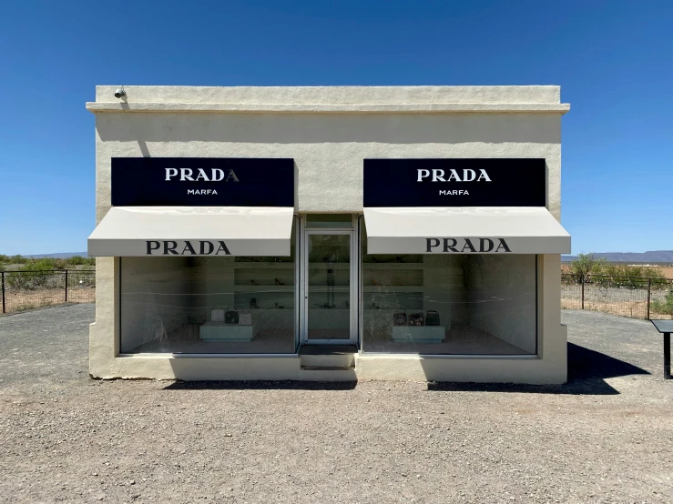 two empty store fronts are shown with a blue sky