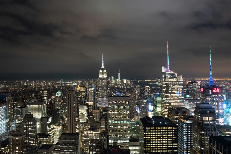 a city skyline with lights at night