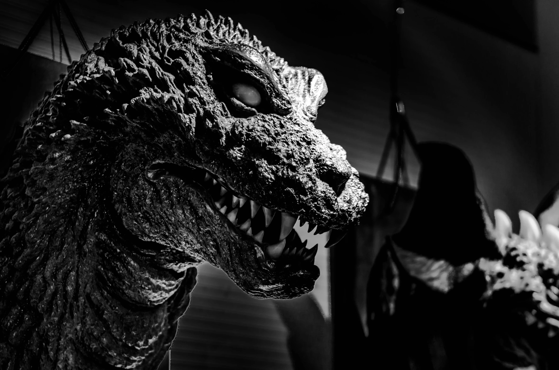 two large stuffed animals sit on display at a museum