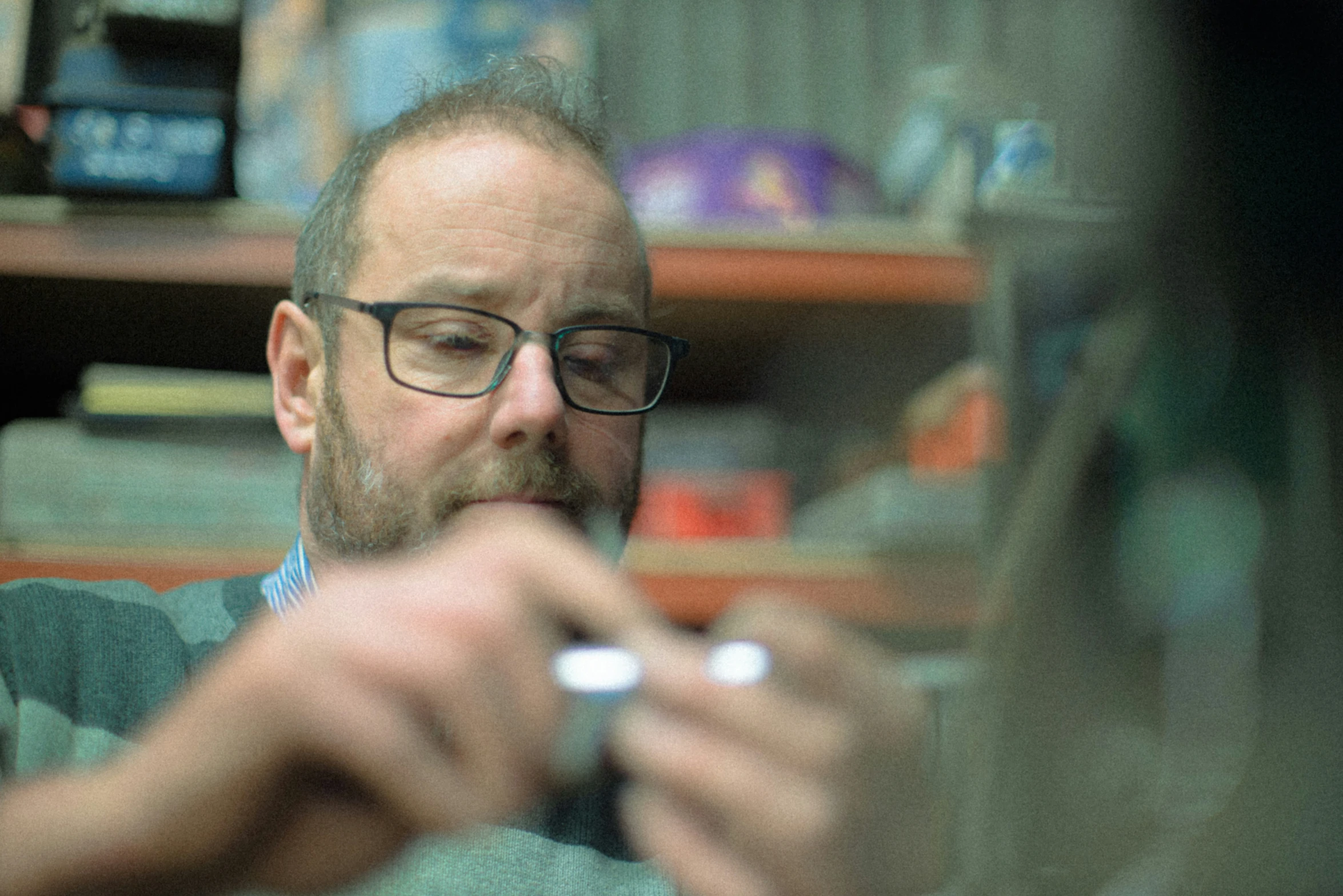 man looking at his reflection in the mirror