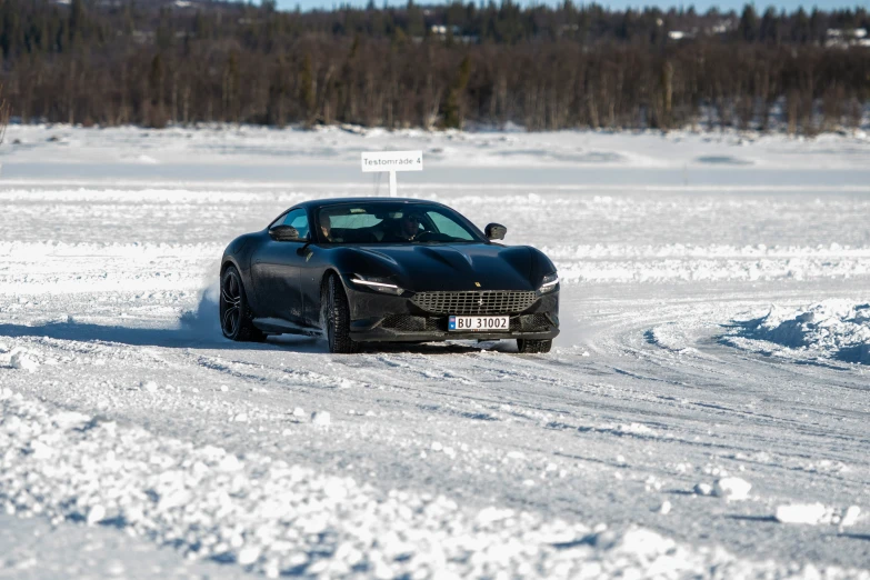 the masera is driving through snow on the road