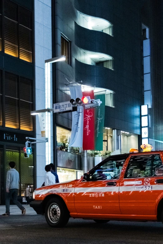 a taxi cab that is red and white