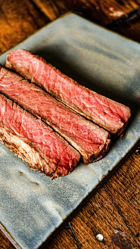 the meat is sliced on the sheet in front of the dish