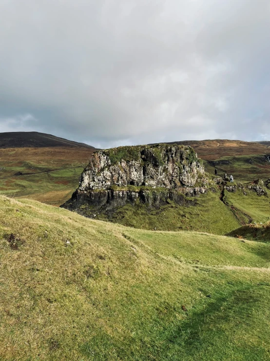 an image of a grassy area with a hill