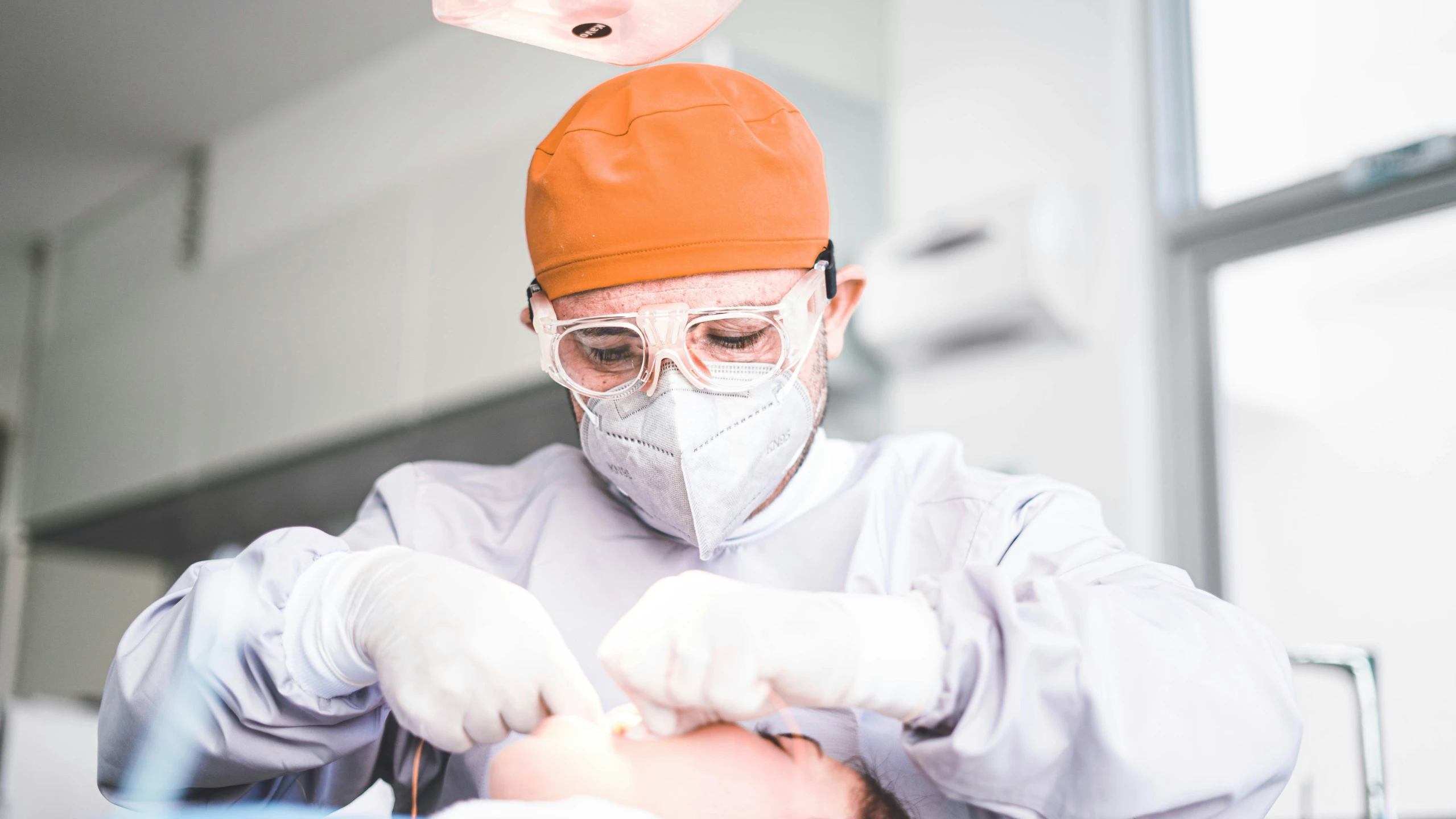 the dentist is giving a patient an injection