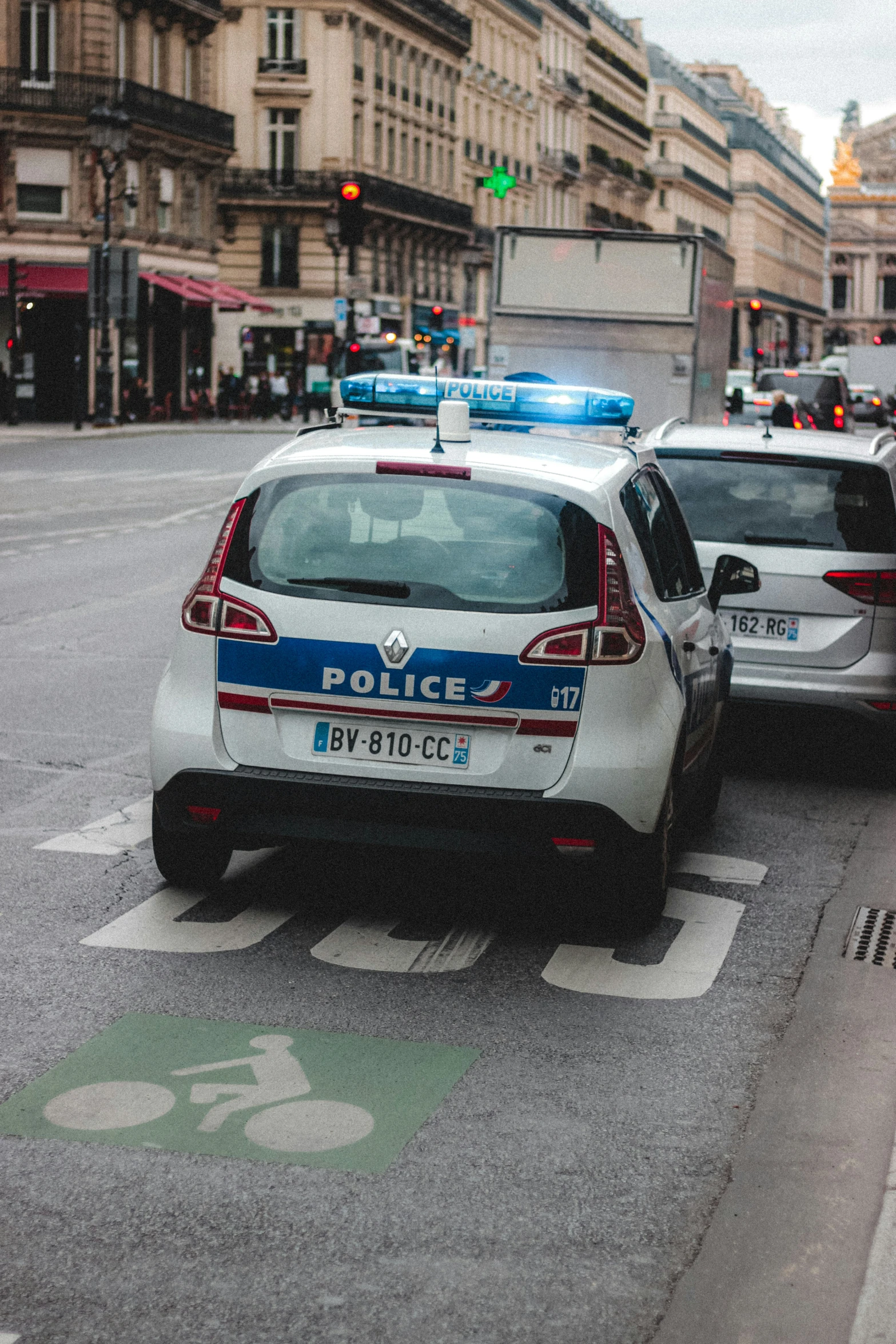 a police car is parked at the corner