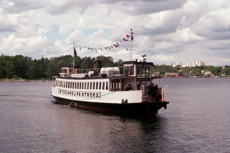 a passenger ferry with people sitting on it