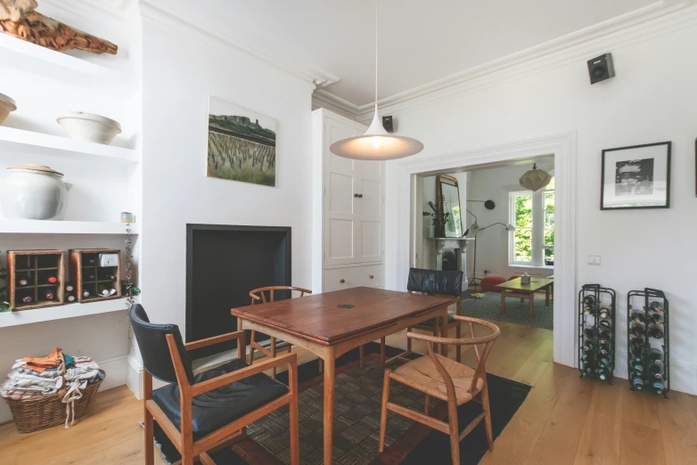 a table is in the middle of a wooden floor