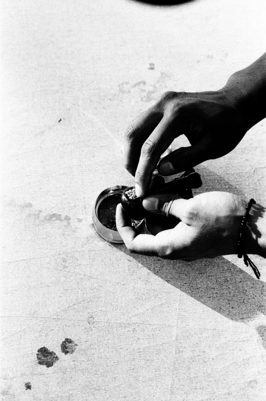 a person cleaning their shoe with a bottle