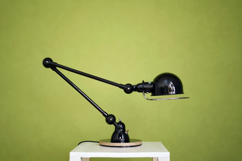 the lamp is mounted on top of the white table