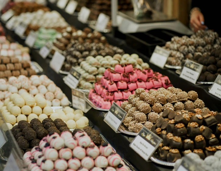 different kinds of chocolates are shown in a display case