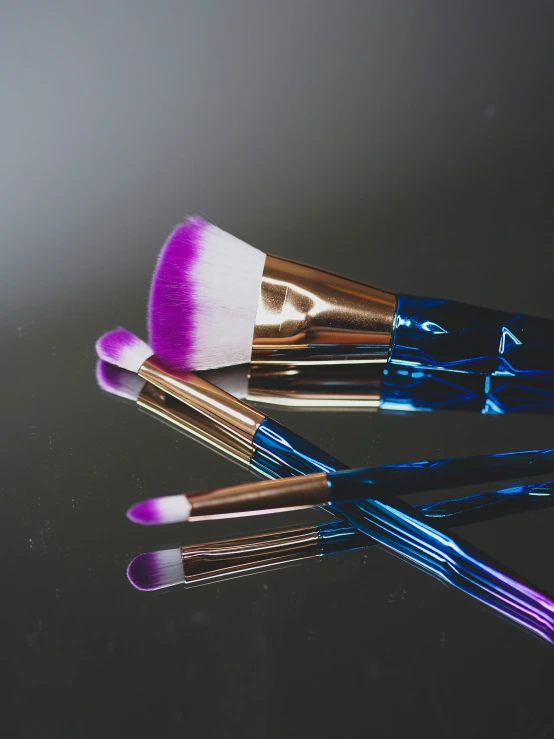 several makeup brushes resting on top of each other